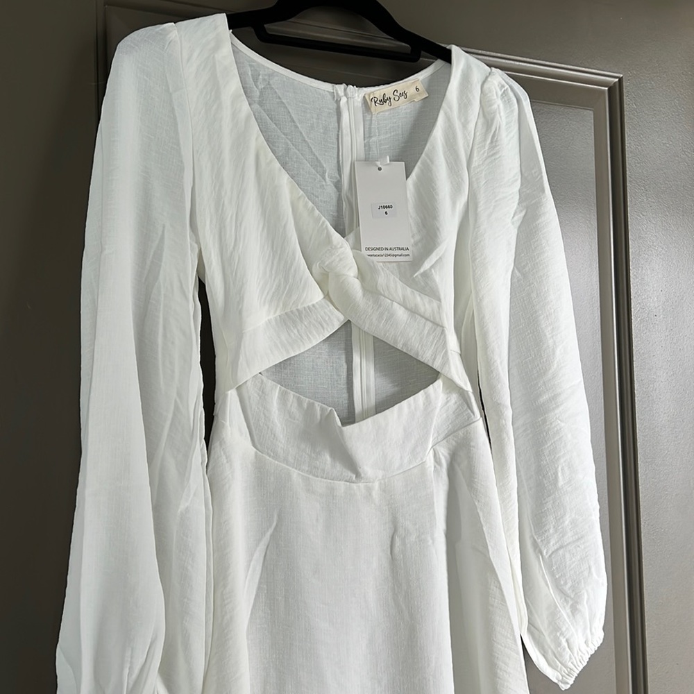 Brand new Ruby Sees long sleeve - white cutout dress. NWT size 6 - fits like 2-4